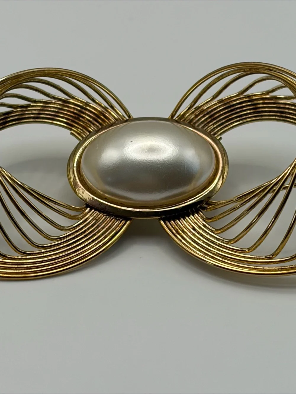 Gold-Tone Bow Brooch with Pearl Center